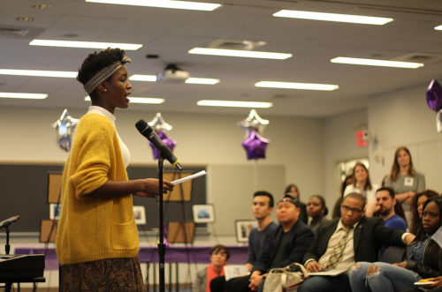 woman speaking at a microphone