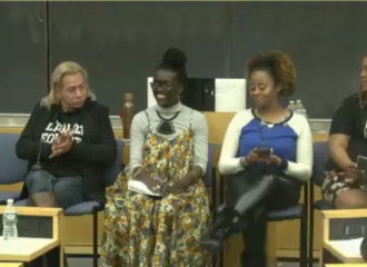 Wakumi and four other women sitting in chairs presenting